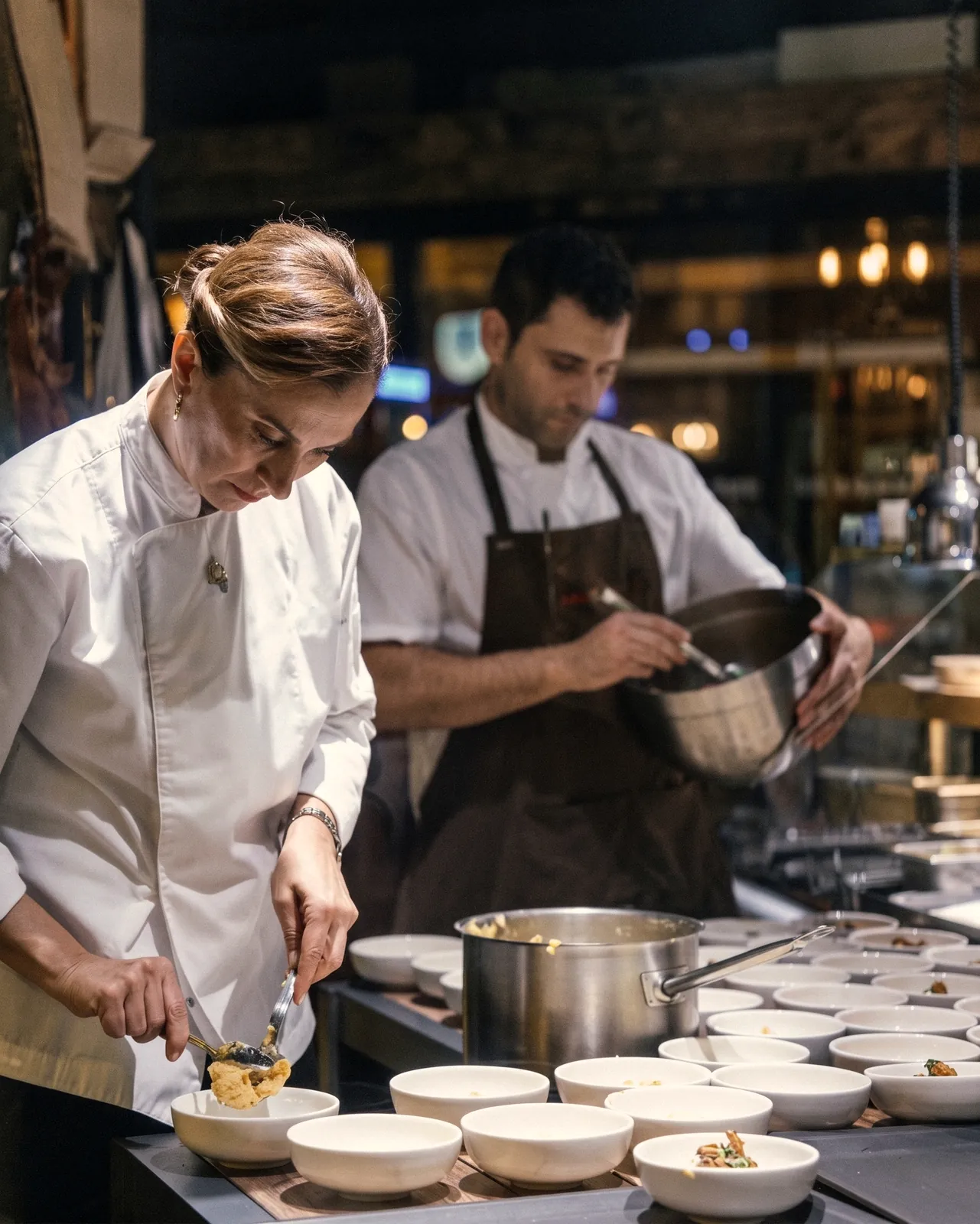 Pınar İshakoğlu Öztaç and Hakan Öztaç at work in the kitchen