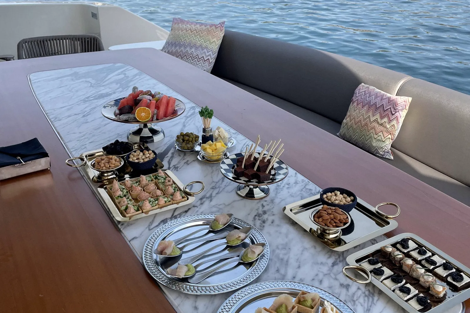 Canape and refreshment trays on a yacht table on the Bosphorus
